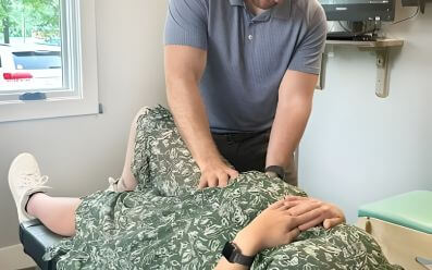 Prenatal chiropractic adjustment on pregnant patient in clinic