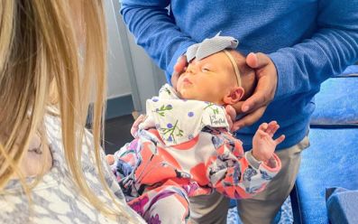 Getting gentle neck pain treatment in a calm pediatric chiropractic setting