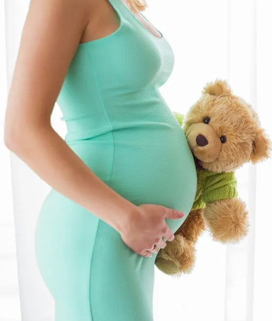 Expecting mother enjoying prenatal chiropractic care to improve mobility and reduce pregnancy discomfort