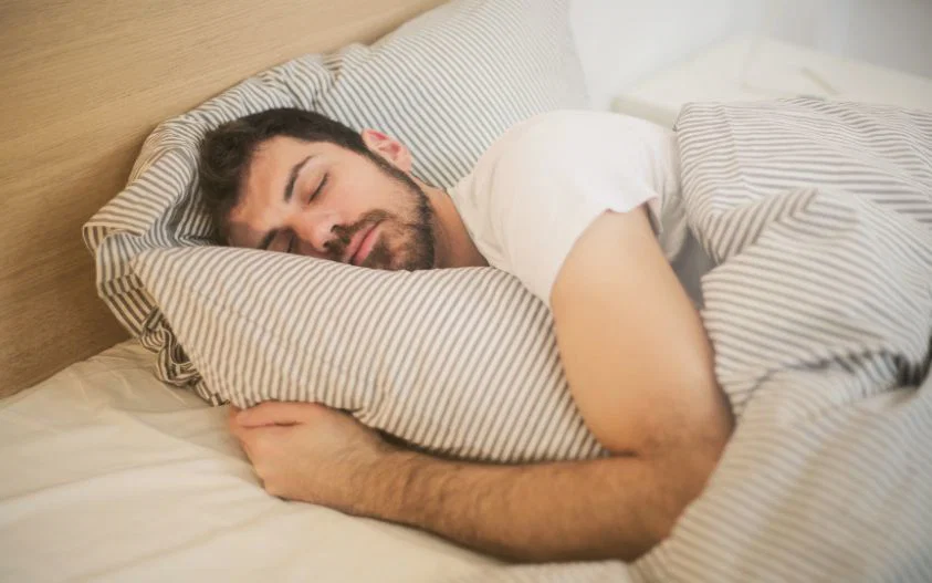Man sleeping comfortably on side